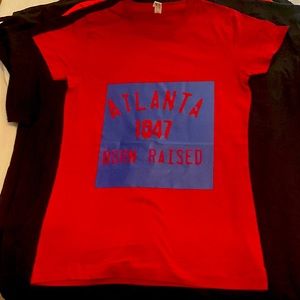 Ladies T’s. Maroon with blue lettering. Really comfortable.